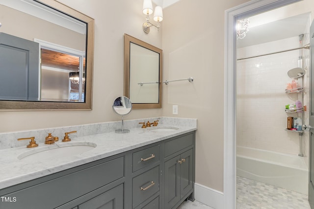 bathroom with tile patterned flooring, vanity, and tiled shower / bath