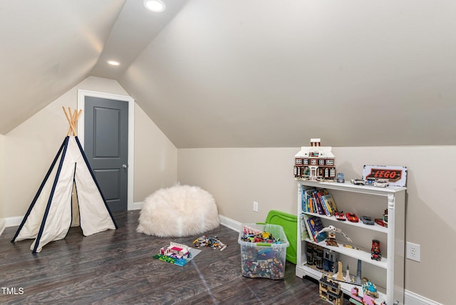 recreation room with vaulted ceiling and dark hardwood / wood-style floors