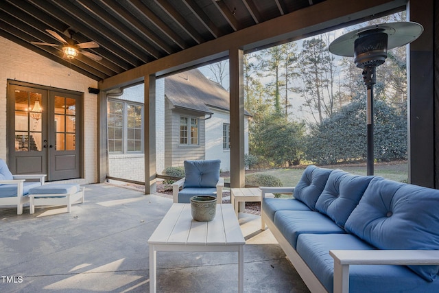 sunroom / solarium featuring french doors, vaulted ceiling, and ceiling fan