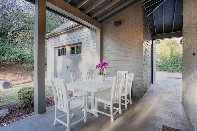 view of patio featuring a garage