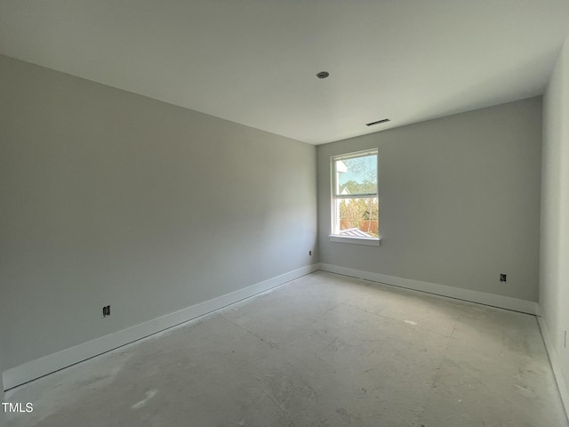 empty room featuring visible vents and baseboards