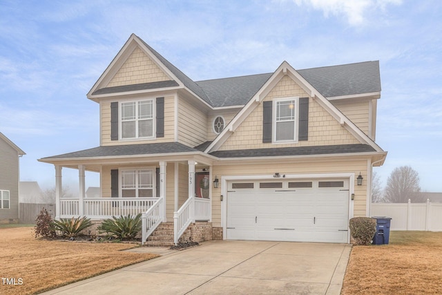 craftsman-style home featuring a porch, a garage, and a front yard