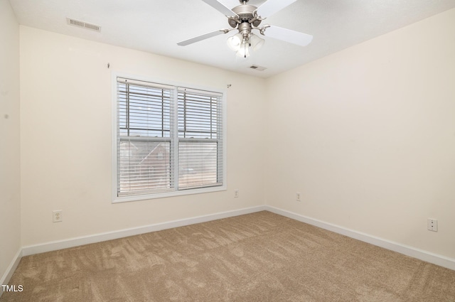 empty room with light carpet and ceiling fan