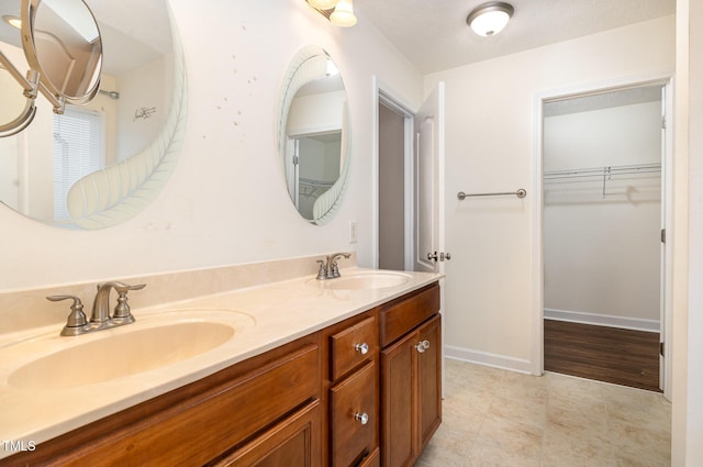 bathroom featuring vanity and a textured ceiling