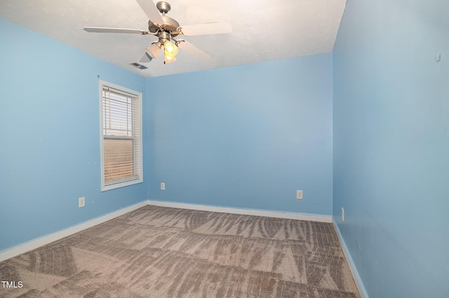 empty room featuring carpet flooring and ceiling fan