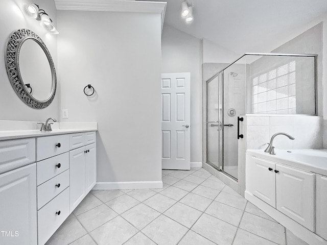 bathroom featuring tile patterned flooring, vanity, a shower with door, and lofted ceiling