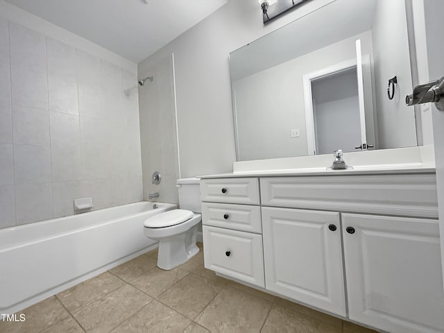 full bathroom featuring tile patterned flooring, vanity, tiled shower / bath combo, and toilet