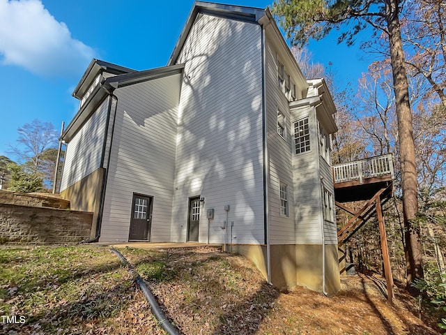 back of house featuring a deck