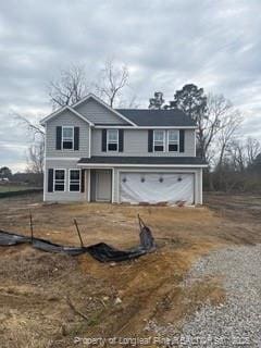 front of property with a garage