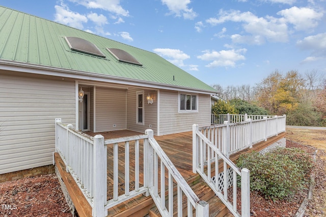 doorway to property featuring a wooden deck