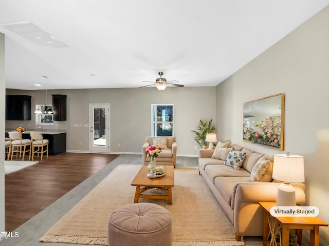 living room with hardwood / wood-style flooring and ceiling fan