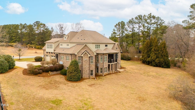 view of side of property with a garage and a sunroom