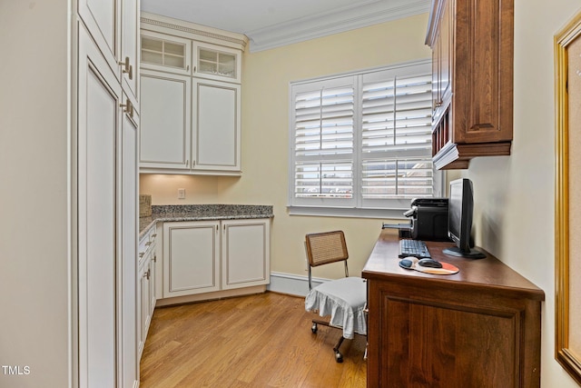 office featuring ornamental molding and light hardwood / wood-style flooring