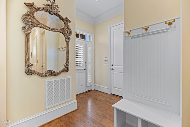 mudroom featuring hardwood / wood-style floors and ornamental molding