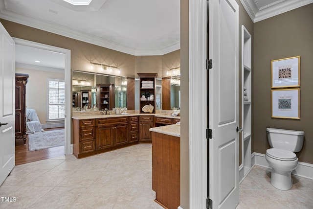 bathroom featuring tile patterned flooring, crown molding, and toilet