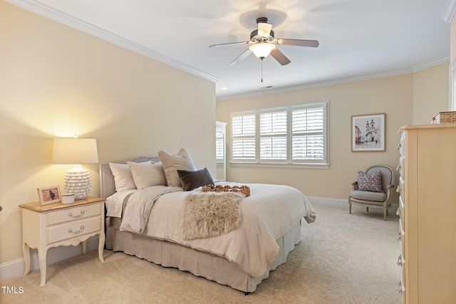 bedroom featuring light carpet, crown molding, and ceiling fan