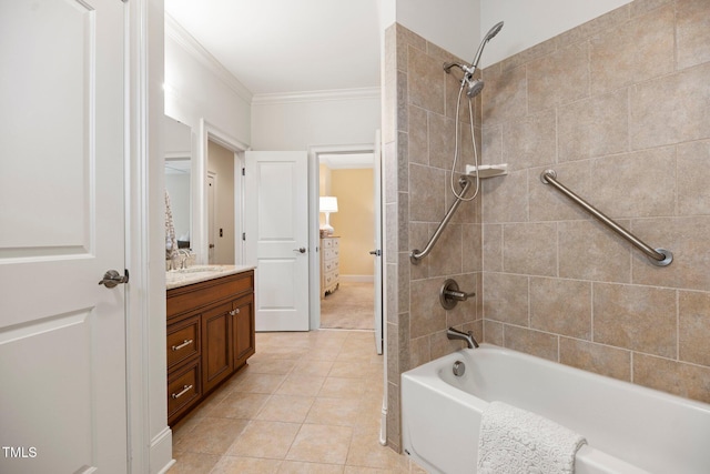 bathroom featuring tiled shower / bath combo, vanity, ornamental molding, and tile patterned flooring