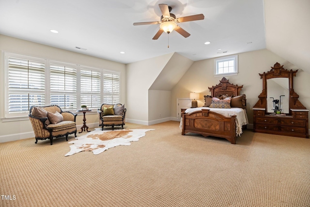 carpeted bedroom featuring multiple windows, vaulted ceiling, and ceiling fan