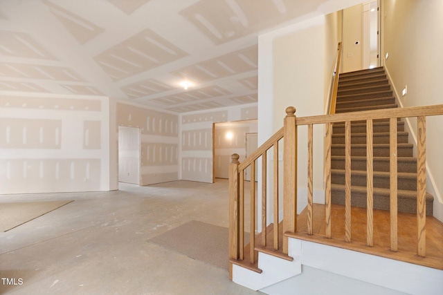 staircase with concrete floors