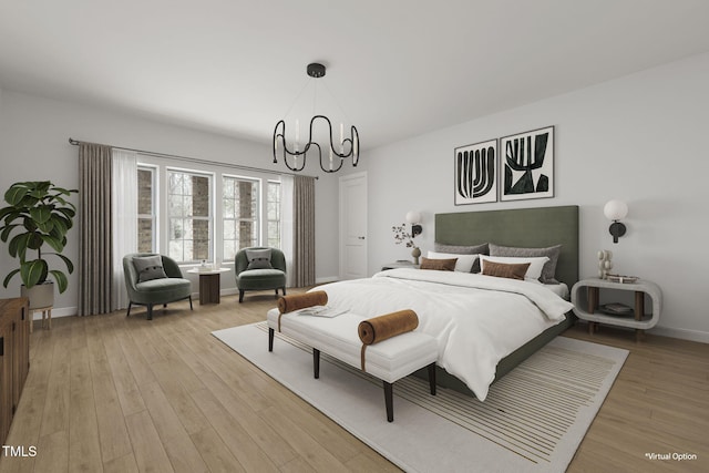 bedroom featuring an inviting chandelier and light hardwood / wood-style floors