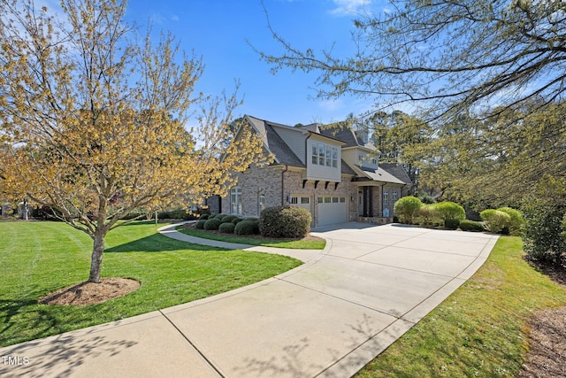 101 Bonica Creek Dr, Garner, NC 27529 - view of front of house featuring concrete driveway, a garage, stone siding, and a front lawn