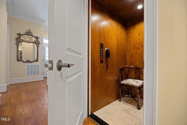101 Bonica Creek Dr, Garner, NC 27529 - interior space featuring baseboards, elevator, crown molding, visible vents, and wood finished floors