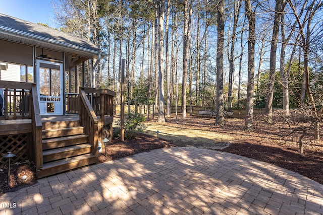 wooden deck with a patio