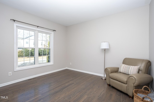 living area with dark hardwood / wood-style floors