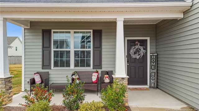 doorway to property with covered porch