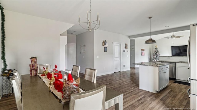 dining room featuring dark hardwood / wood-style floors and ceiling fan with notable chandelier