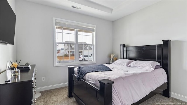 bedroom featuring light colored carpet