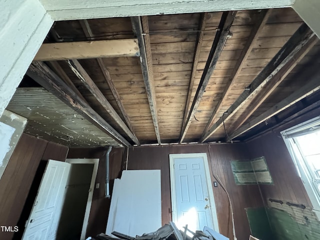 misc room featuring wooden walls and wooden ceiling