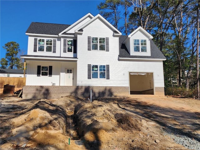 view of front of property featuring a garage