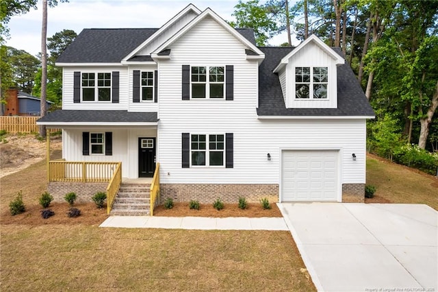 501 Randolph Ave, Fayetteville, NC 28311 - view of front of home with covered porch, a shingled roof, a garage, a front lawn, and concrete driveway