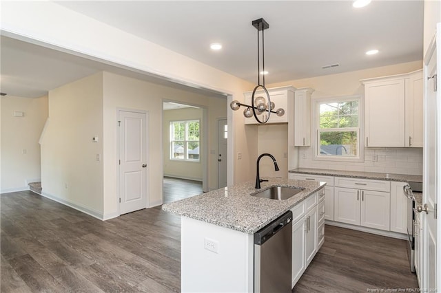 501 Randolph Ave, Fayetteville, NC 28311 - kitchen with dishwasher, a sink, a center island with sink, dark wood finished floors, and white cabinets