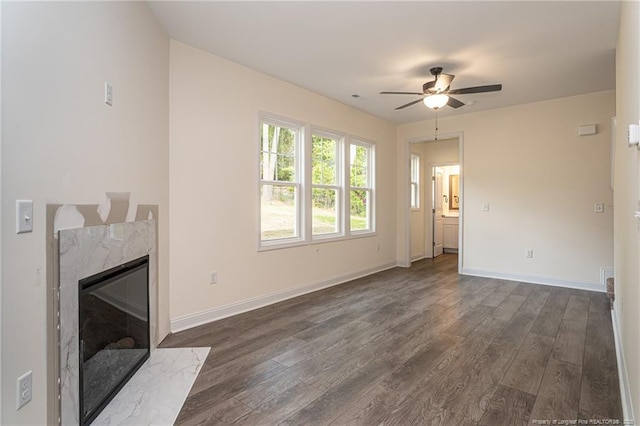 501 Randolph Ave, Fayetteville, NC 28311 - unfurnished living room with dark wood finished floors, ceiling fan, a premium fireplace, and baseboards