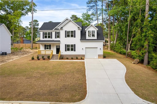 501 Randolph Ave, Fayetteville, NC 28311 - view of front of home featuring a porch, concrete driveway, a front yard, roof with shingles, and a garage