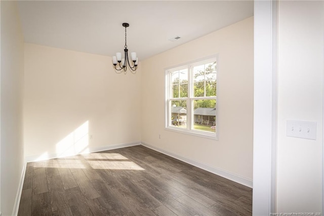 501 Randolph Ave, Fayetteville, NC 28311 - spare room featuring a chandelier, dark wood-type flooring, and baseboards