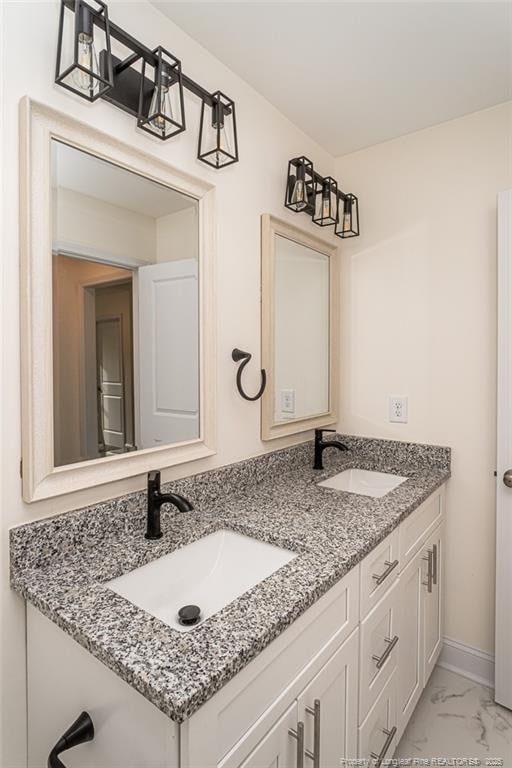 501 Randolph Ave, Fayetteville, NC 28311 - full bathroom featuring double vanity, marble finish floors, and baseboards