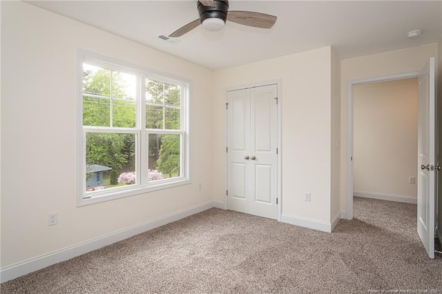 501 Randolph Ave, Fayetteville, NC 28311 - unfurnished bedroom with carpet flooring, baseboards, a closet, and ceiling fan