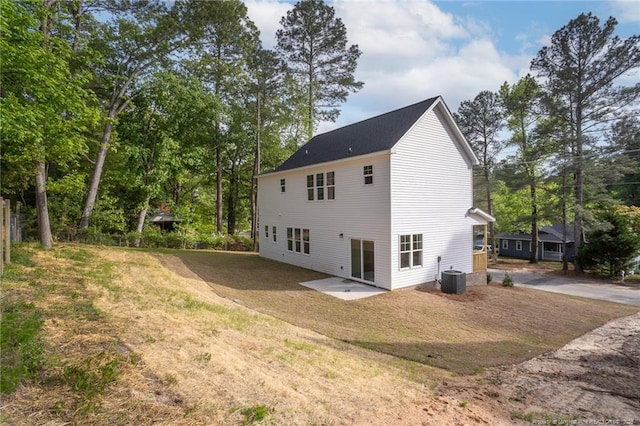501 Randolph Ave, Fayetteville, NC 28311 - rear view of house featuring central AC, driveway, a patio, and a yard