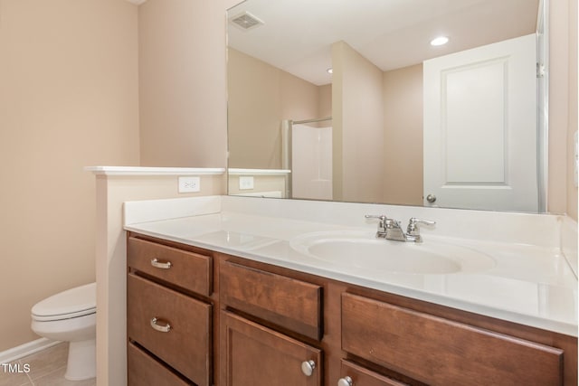 full bathroom with toilet, vanity, visible vents, a shower, and tile patterned floors