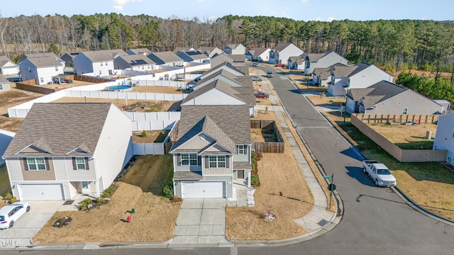 bird's eye view featuring a residential view and a view of trees