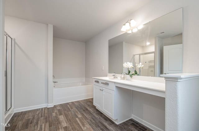 full bath with a garden tub, visible vents, a stall shower, vanity, and wood finished floors