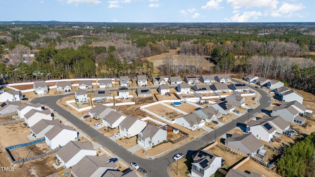 aerial view with a forest view and a residential view