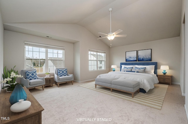 carpeted bedroom featuring lofted ceiling, ceiling fan, and baseboards