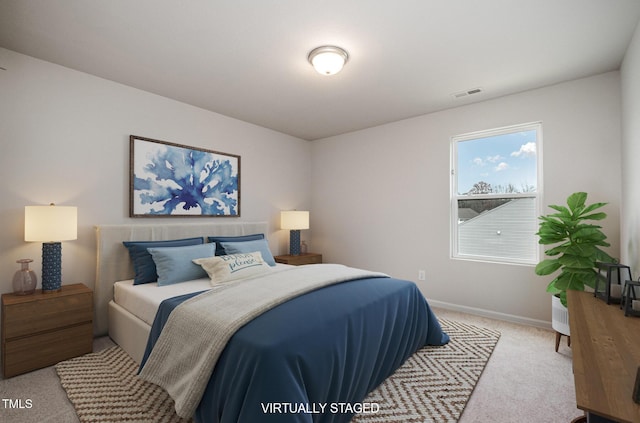 bedroom featuring light carpet, baseboards, and visible vents