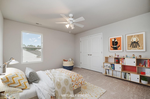 bedroom with carpet floors, a ceiling fan, visible vents, and a closet