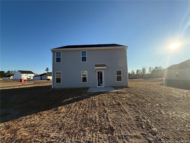 back of property featuring a patio