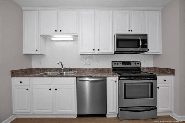 kitchen with white cabinets, sink, and stainless steel appliances